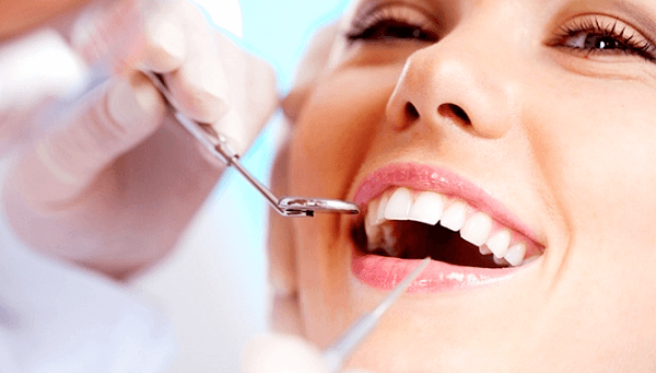 лечить зубы